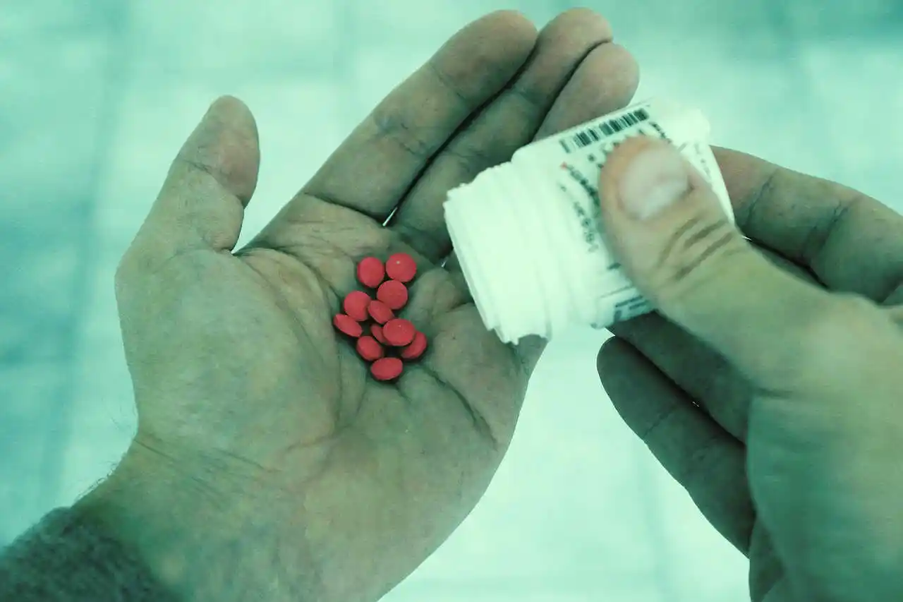 Assorted pharmaceutical packs displayed under warm daylight.
